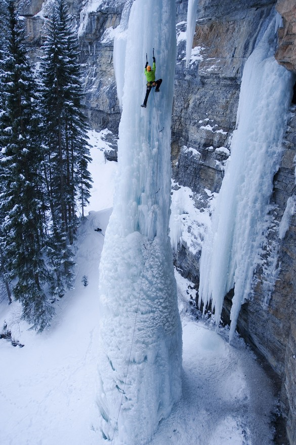 Ice climbing a frozen waterfall.